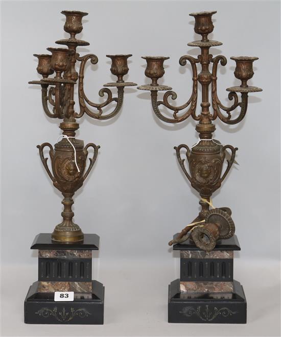 A pair of Victorian spelter and marble four-light candelabra, possibly part of a clock garniture (one a.f), H.51cm